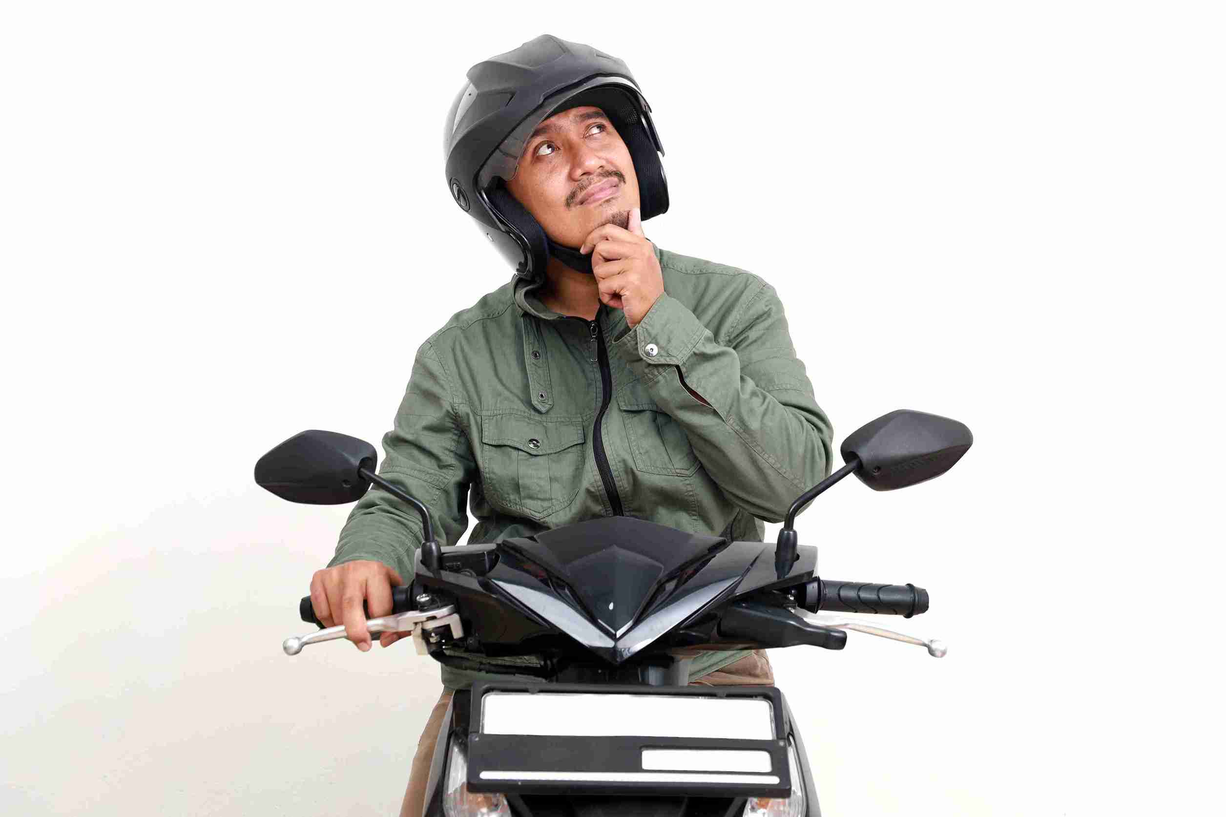 Thoughtful Asian Man Thinking Looking While Driving Motorcycle Isolated White Background 11Zon