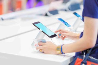 Woman Choosing New Mobile Phone Shop 11Zon 1